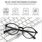 Modern anti-blue light glasses on a black keyboard