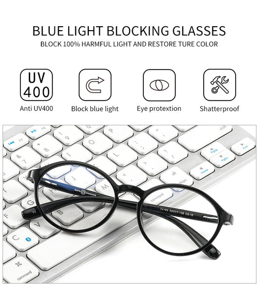 Modern anti-blue light glasses on a black keyboard